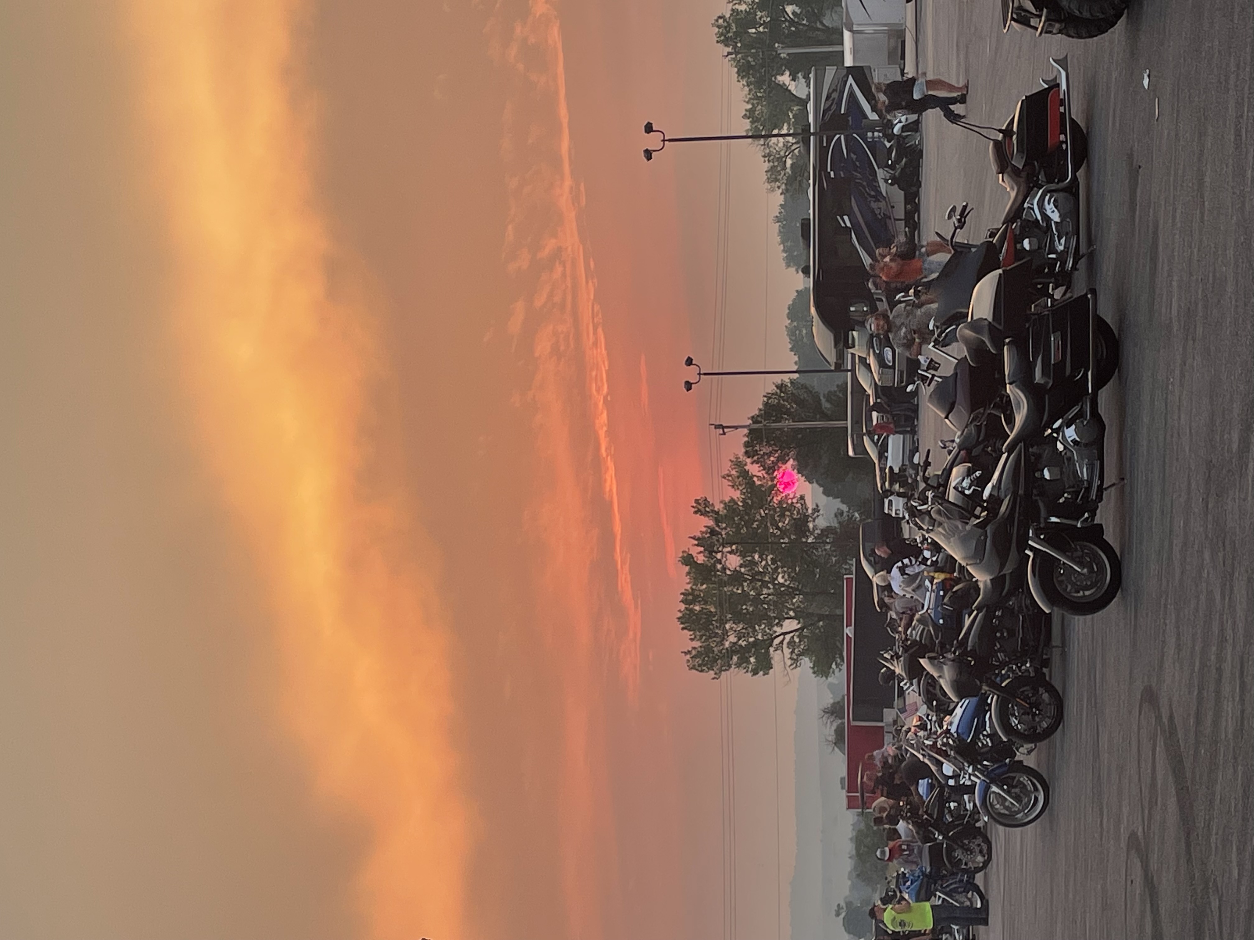 Smokey sunset over motorcycles at Sturgis Rally